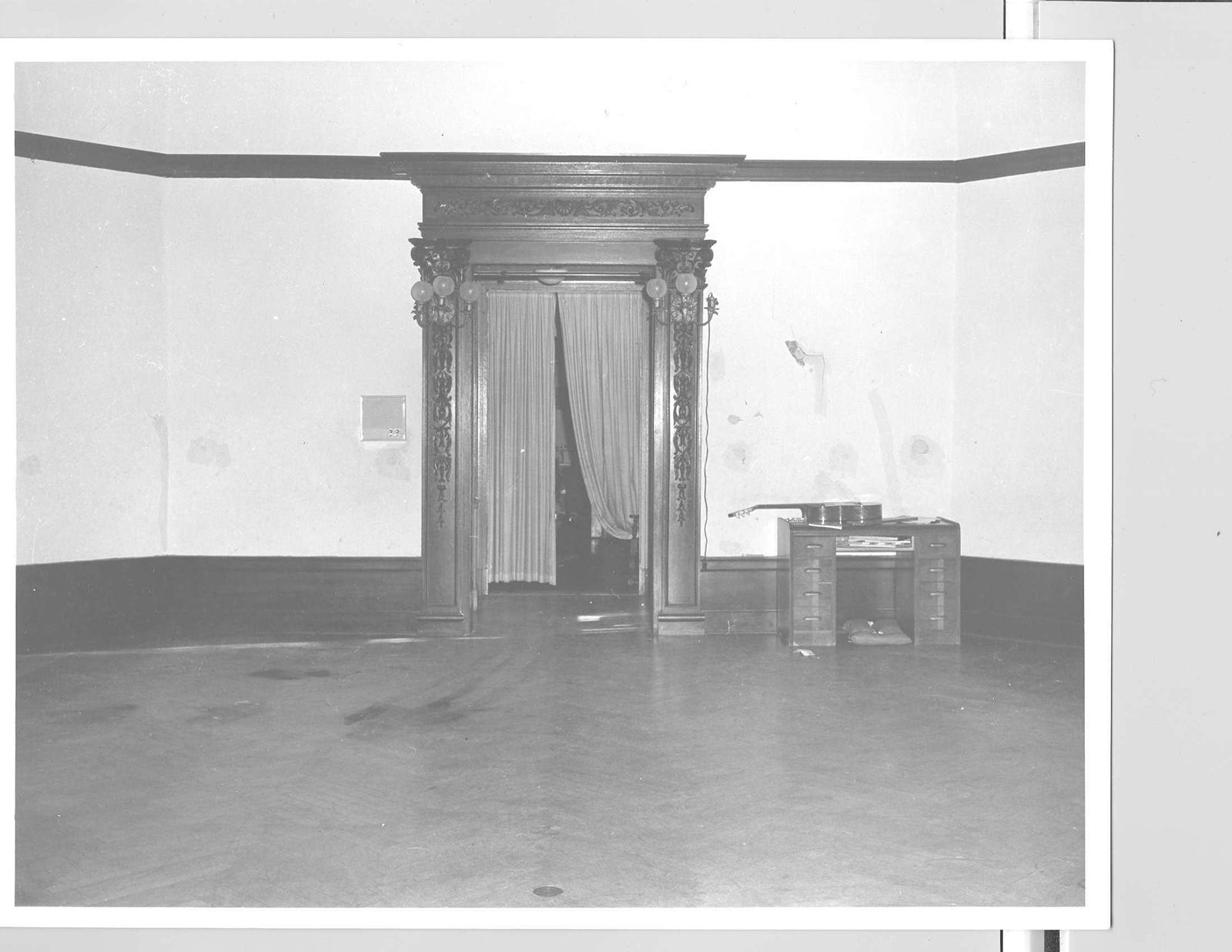Blood stains are visible on the floor of the ballroom after the bodies and sleeping bags were removed.