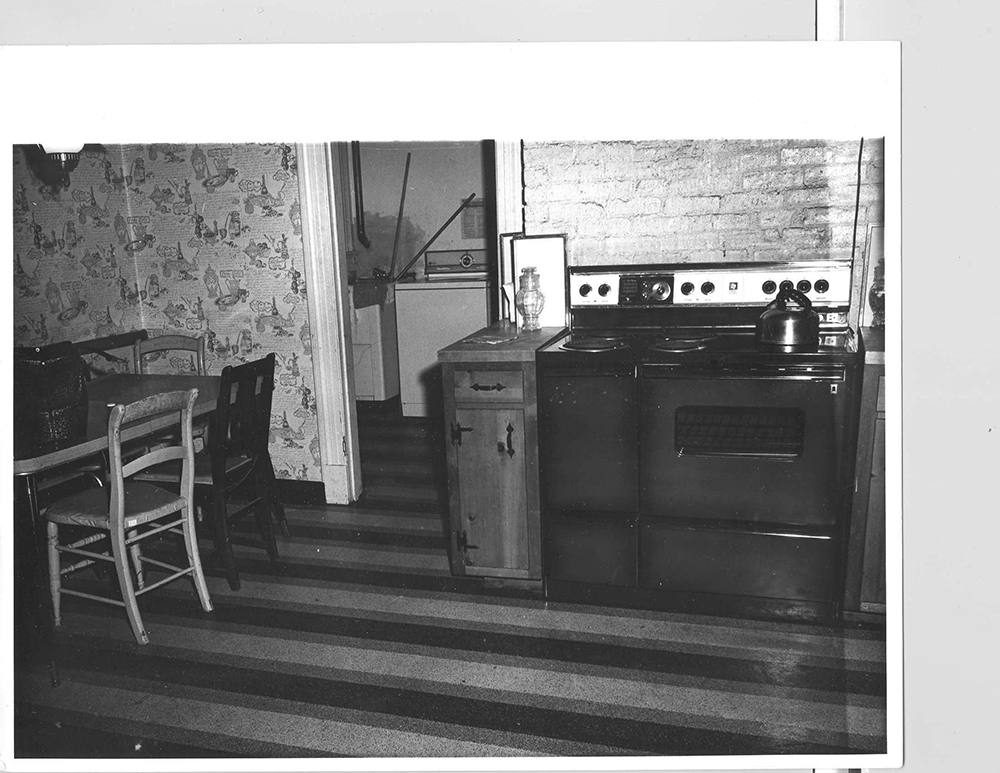 A view of the List kitchen, including the table where Helen List was shot, and into the laundry room